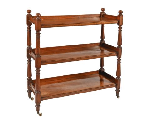 A Victorian mahogany dumb waiter, on pottery castors, 110cm h; 43 x 103cm  Split to back rail on top shelf