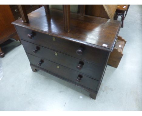 Antique oak chest of three long drawers on bracket feet
