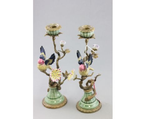 Pair of Victorian style ormolu and ceramic candlesticks depicting tropical birds