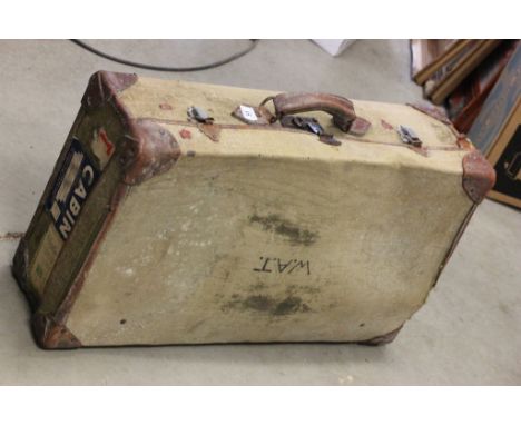 Vintage Leather and Canvas Suitcase with various luggage labels