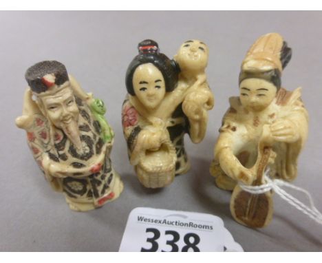 Three netsuke figures including Lady with Harp
