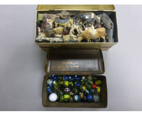 Tin of Lead Farm Animals including Britains together with a Tin of Vintage Marbles