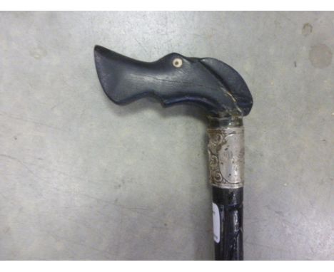 An ebonised dog head walking stick