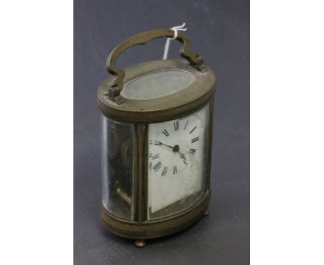 Gilt Brass Oval Cased Carriage Clock with White Enamel Face