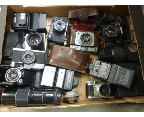 Collection of various cameras including vintage and modern featuring Purma, Paxette, Olympus Trip and Kodak