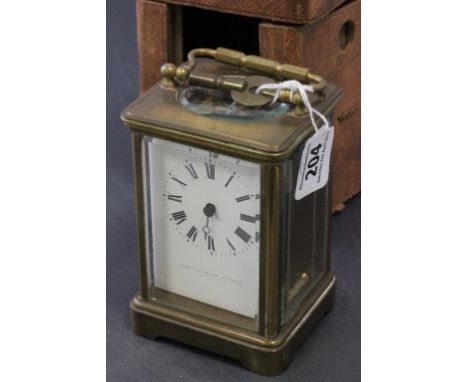 19th century Gilt Brass Carriage Clock, the white enamel face marked Webster & Co in leather travelling case (glass face miss
