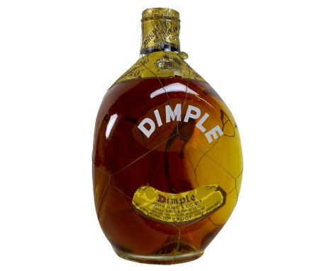 A bottle of Haig's 'Dimple' old blended Scotch whisky, circa 1960, label inscribed 'By Appointment To Her Majesty The Queen',