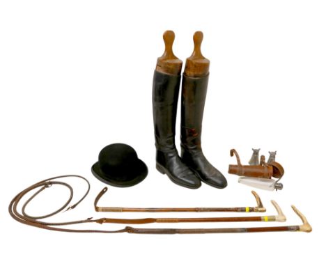 A pair of black leather hunting boots with wooden boot trees, a Lock &amp; Co black bowler hat, wto leather and bone-handled 