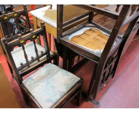 Oak drop leaf gate leg table and four Ercol labelled dining chairs