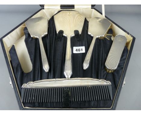 Cased five piece silver dressing table set of hand mirror, three brushes and comb (one further brush lacking) Birmingham circ