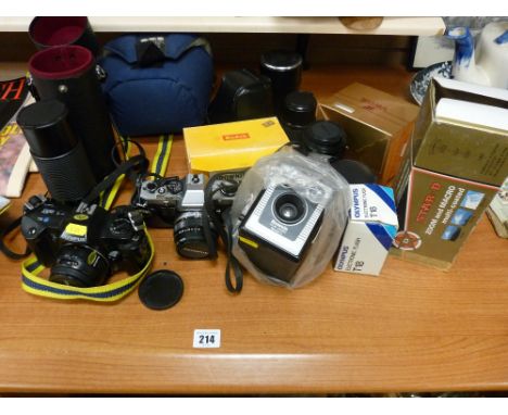 Parcel of cameras and photographic equipment to include a Kodak Brownie Box camera, a Sigma lens etc 