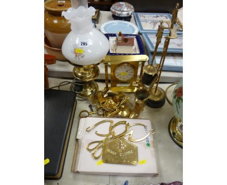 Parcel of brassware including fire irons, mantel clock, oil lamp etc