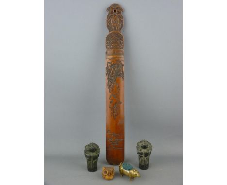 Oriental carved wood page turner, a carved owl netsuke, two Oriental toad top metal cane handles and a brass pig pin cushion