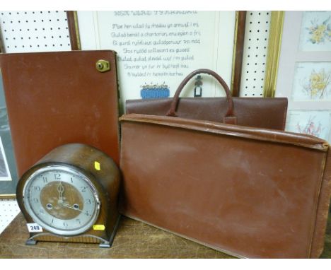 Three vintage attache cases and a polished mantel clock