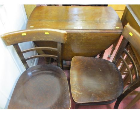 Drop leaf barley twist gate leg table and two wooden chairs