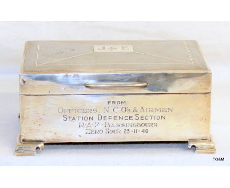 A hallmarked silver cigarette box 14cm x 9cm x 6cm on bracket feet engraved JSE from Officers NCOs &amp; Airmen - Station Def