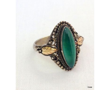 A silver and jade set ring