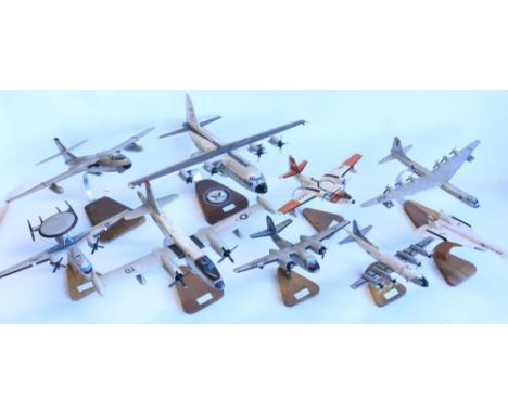 Collection of static model aircraft, all post war international themed, all appear hand carved wood with stands, generally no