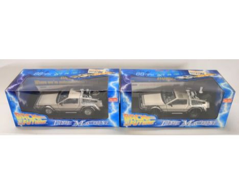 Two boxed 1/18 scale well detailed diecast DeLorean car models from the motion picture Back To The Future, both signed on the