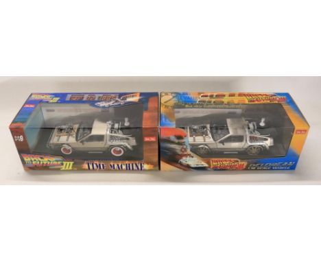 Two boxed 1/18 scale well detailed diecast DeLorean car models from the motion picture Back To The Future Part III, both sign