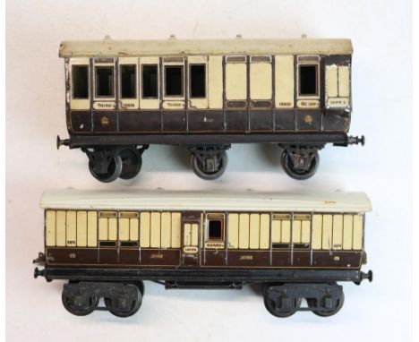 Two pre-war tin plate 1 gauge LNWR railway coaches to include Marklin 2874 and Carette 3rd class 13312Shipping £48.00 plus va