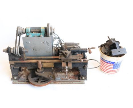 Small but heavy duty bench top lathe by George Adams in working order plus a box of accessories, base W52xD32cmShipping £68.0