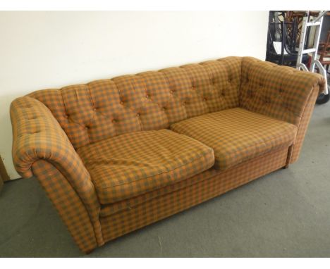 A Chesterfield style settee in check button fabric 