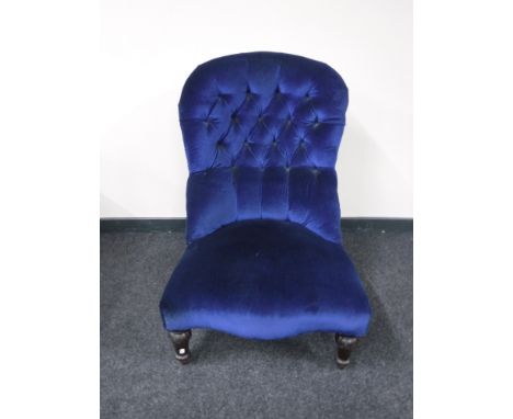 A Victorian lady's chair in blue button fabric 