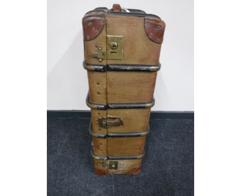 An early 20th century wooden bound travelling trunk 