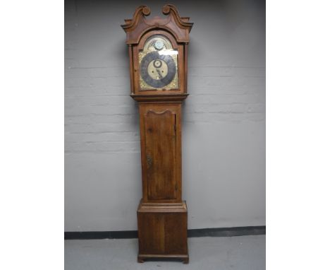 A continental oak longcase clock with pendulum and weights 