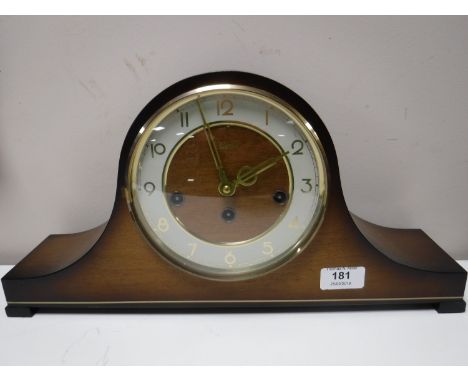 A German Hermle oak mantel clock with key CONDITION REPORT: There is no visible date. 