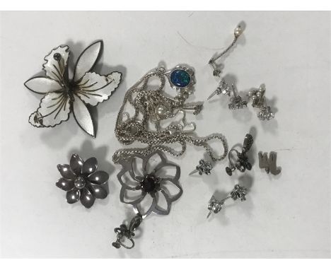A collection of silver jewellery including a Norwegian enamel flower brooch