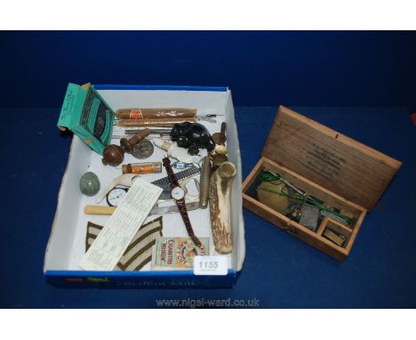 A box of miscellanea including cigars, apothecary scales, watches, etc.