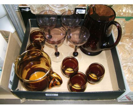 A Bohemian Ruby flash glass Lemonade jug and five glasses with another Lemonade jug and six glasses.
