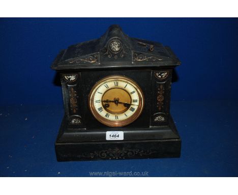A slate mantle clock with roman numerals with floralinlays and key