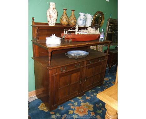 An Edwardian Mahogany Buffet Sideboard, having upstand back with two shelves on turned supports, one narrow, the other full d