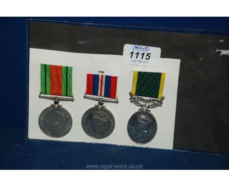 A group of three Medals presented to a Lady, being WWII Defence & War Medals, with GV I Efficiency Medal to a S.Sgt Army Terr