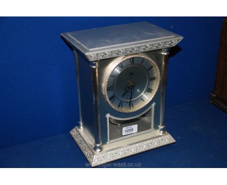 A German made Meazzi white metal cased Georgian style mantle Clock, rectangular shape with geometric pattern embossed cornice