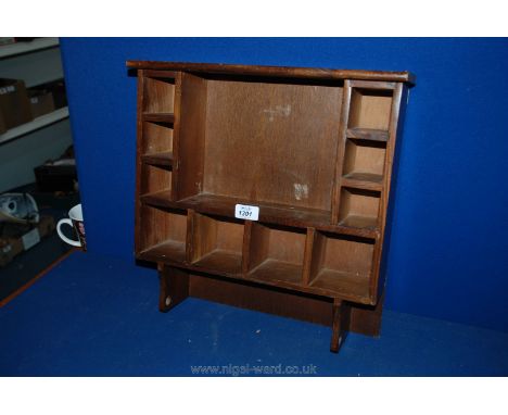 A wooden Wall Shelf with eleven sections.