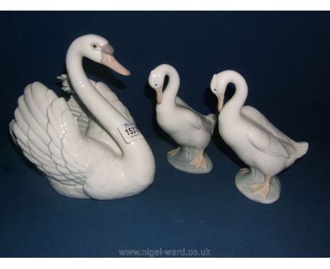 A Nao figurine of a Swan with wings spread ,no. 5231 and two Nao figures of Geese