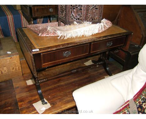 A reproduction Georgian style Sofa Table, moulded edge top with tooled leather insert with similar round cornered drop leaves