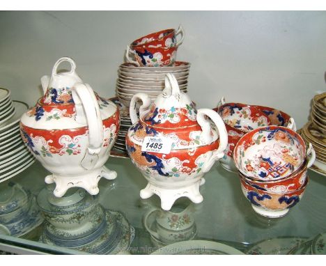 A Royal Stafford Teaset with chinoiserie decoration including teapot, sucrier, seven cups, saucers and side plates, etc.