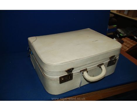 A cream coloured vintage weekend Case.