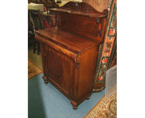 A small Victorian Mahogany Chiffonier, having upstand back with carved top over single shelf on scroll carved corbel supports