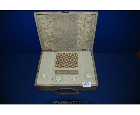 A vintage Marconiphone Radio in a faux snakeskin case.