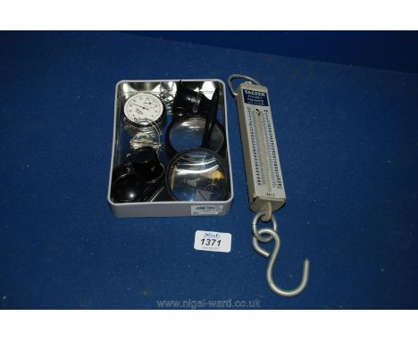 A stop Watch, magnifying glasses, eye pieces and Salters Scales No. 3.
