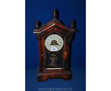 A 19th c. Rosewood finished Architectural Mantle Clock, pitched top with three finials and moulding, single pane, gilt decora