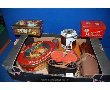 A cased Brownie Camera, USSR Binoculars, shoe shining kit (leather cased), and a quantity of old tins, etc.