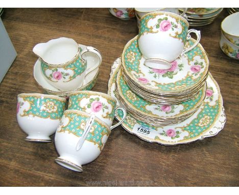 A pretty vintage part Roslyn China Rosamund pattern Teaset, including six tea plates, milk jug, sugar bowl and a cake plate.