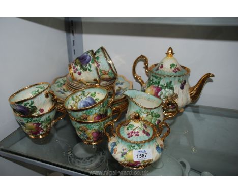 A Raymond Everill 'Princess Royal' Tea Service, fruit decorated, including teapot, sugar bowl, milk jug, six cups and saucers